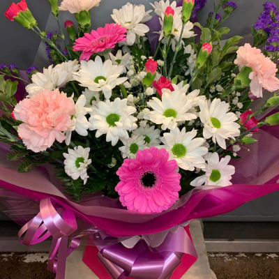 Ashleigh - A budding delight, complimented by greenery and presented in a gift box/bag. Beautiful flower bouquet hand delivered by the local florist.